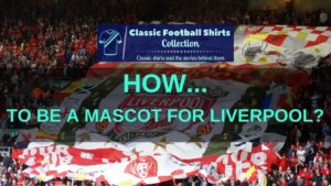 Fans in the Kop at Anfield with a large flag